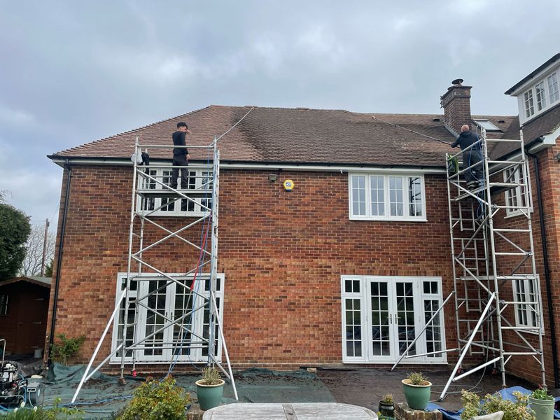 Roof cleaning carried out safely from scaffold towers by The Roof Moss Cleaners in Salisbury